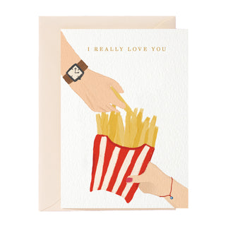 Tarjeta de felicitación con "Te amo mucho", papas fritas